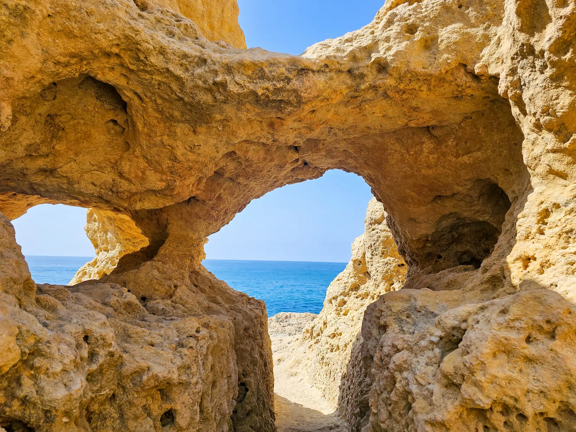 The dramatic weathered limestone windows and ocean blowholes of the Algar Seco rock formations in Carvoeiro