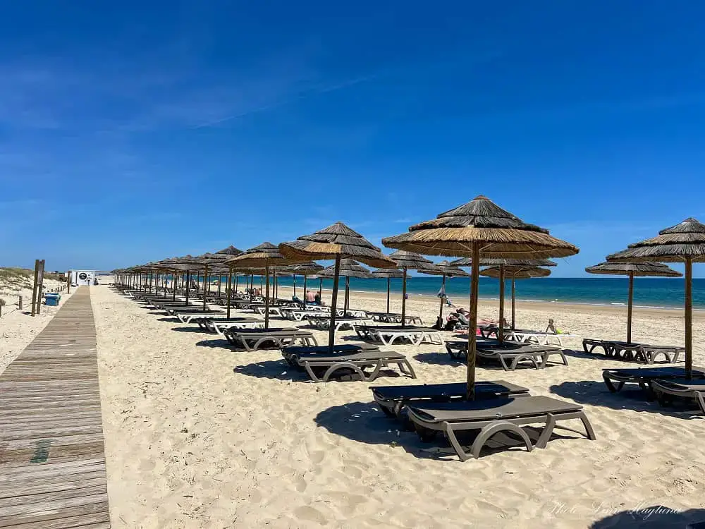 Wide view of the golden sand dunes and pristine beaches along the coastline at Cabanas de Tavira