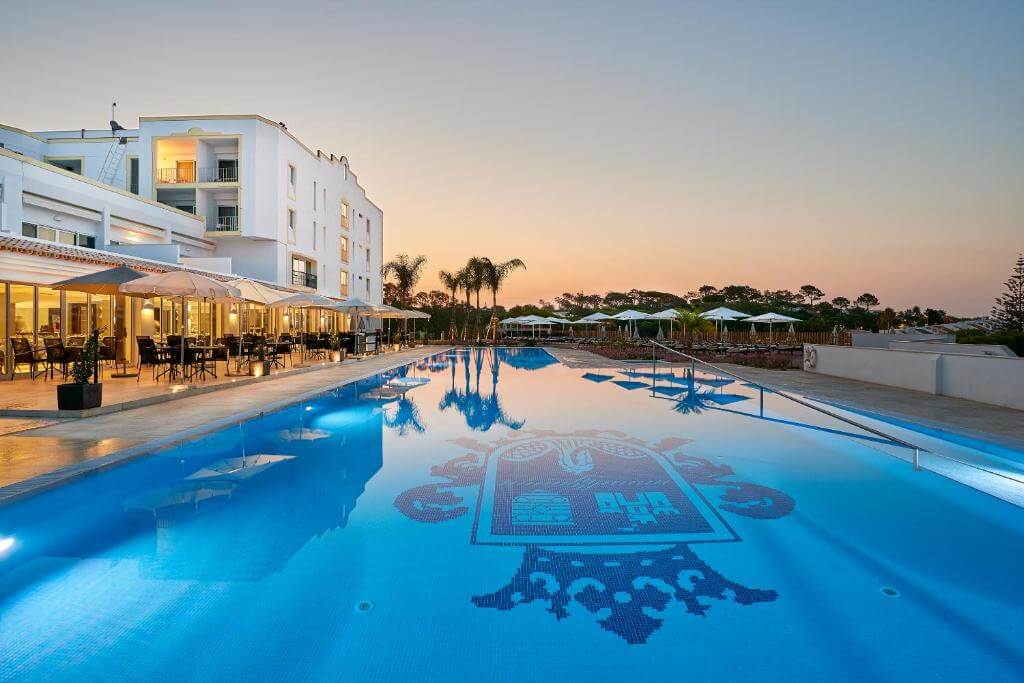 The luxurious beachfront exterior, entryways, and classic architecture of Hotel Dona Filipa in Vale do Lobo