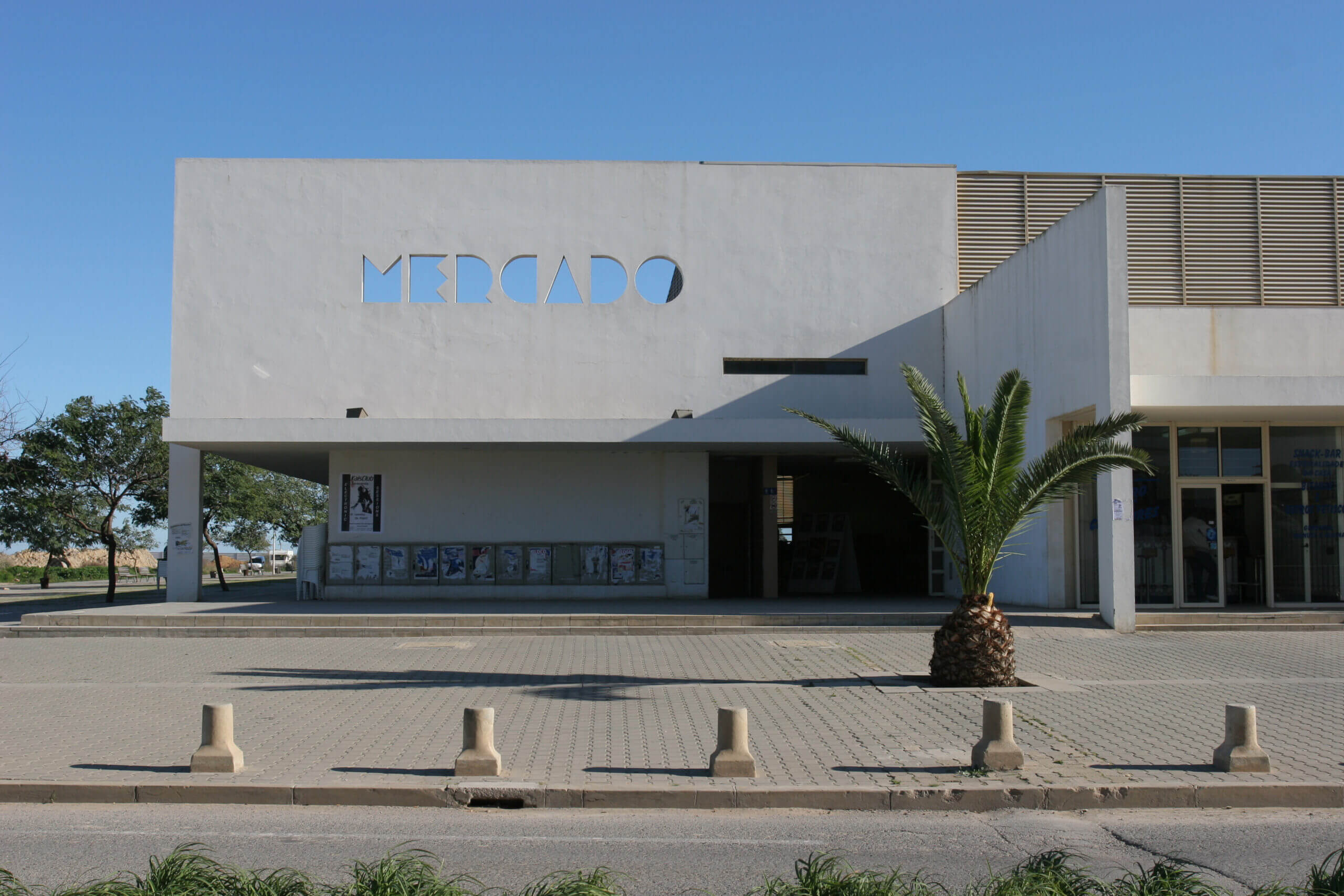 The modern, bustling municipal market hall building in Tavira where fresh local fish, fruits, and regional Algarve produce are sold daily