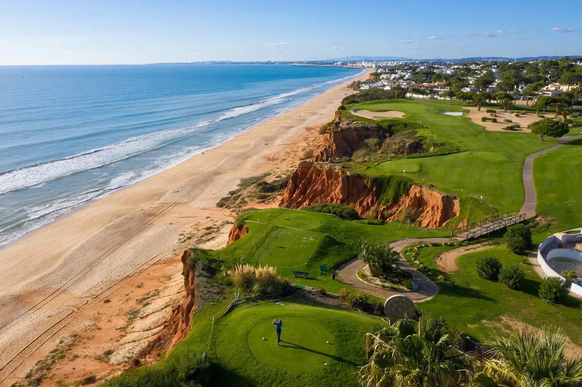 The pristine fairways, greens, and red cliffside bunkers of the prestigious Ocean and Royal Golf Courses in Vale do Lobo
